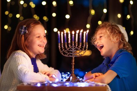 Kids,Celebrating,Hanukkah.,Jewish,Festival,Of,Lights.,Children,Lighting,Candles