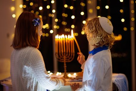 Kids,Celebrating,Hanukkah.,Jewish,Festival,Of,Lights.,Children,Lighting,Candles